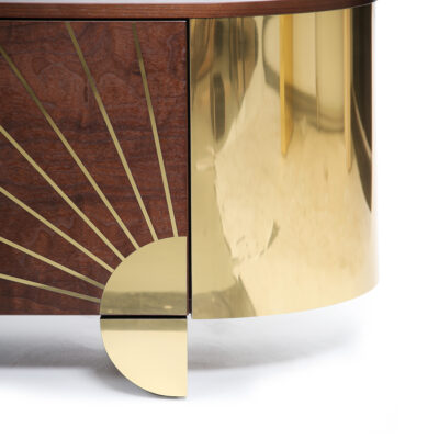 Close-up of Astor Sideboard showing brass detailing across walnut wood surface.