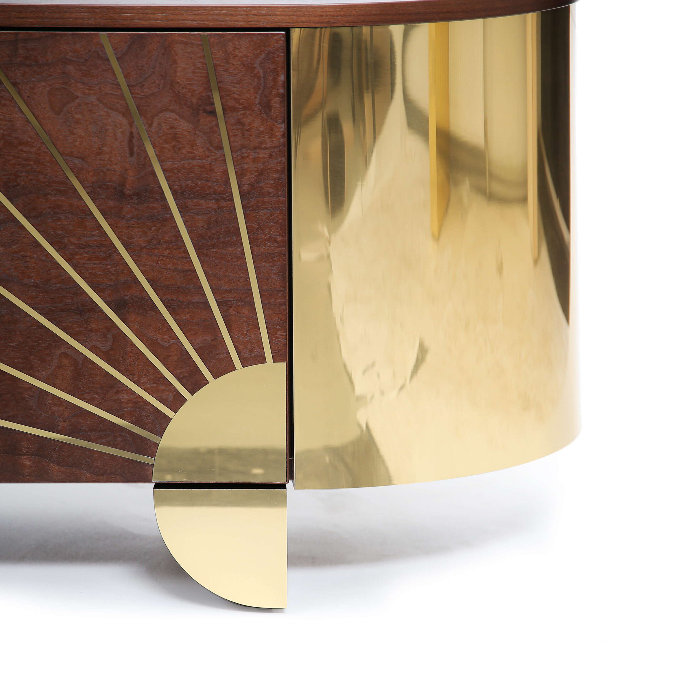 Close-up of Astor Sideboard showing brass detailing across walnut wood surface.